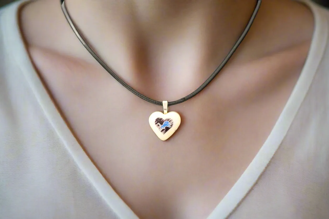 Heart-Shaped Ceramic Pendant with Blue Lion and Black Brushstroke Design