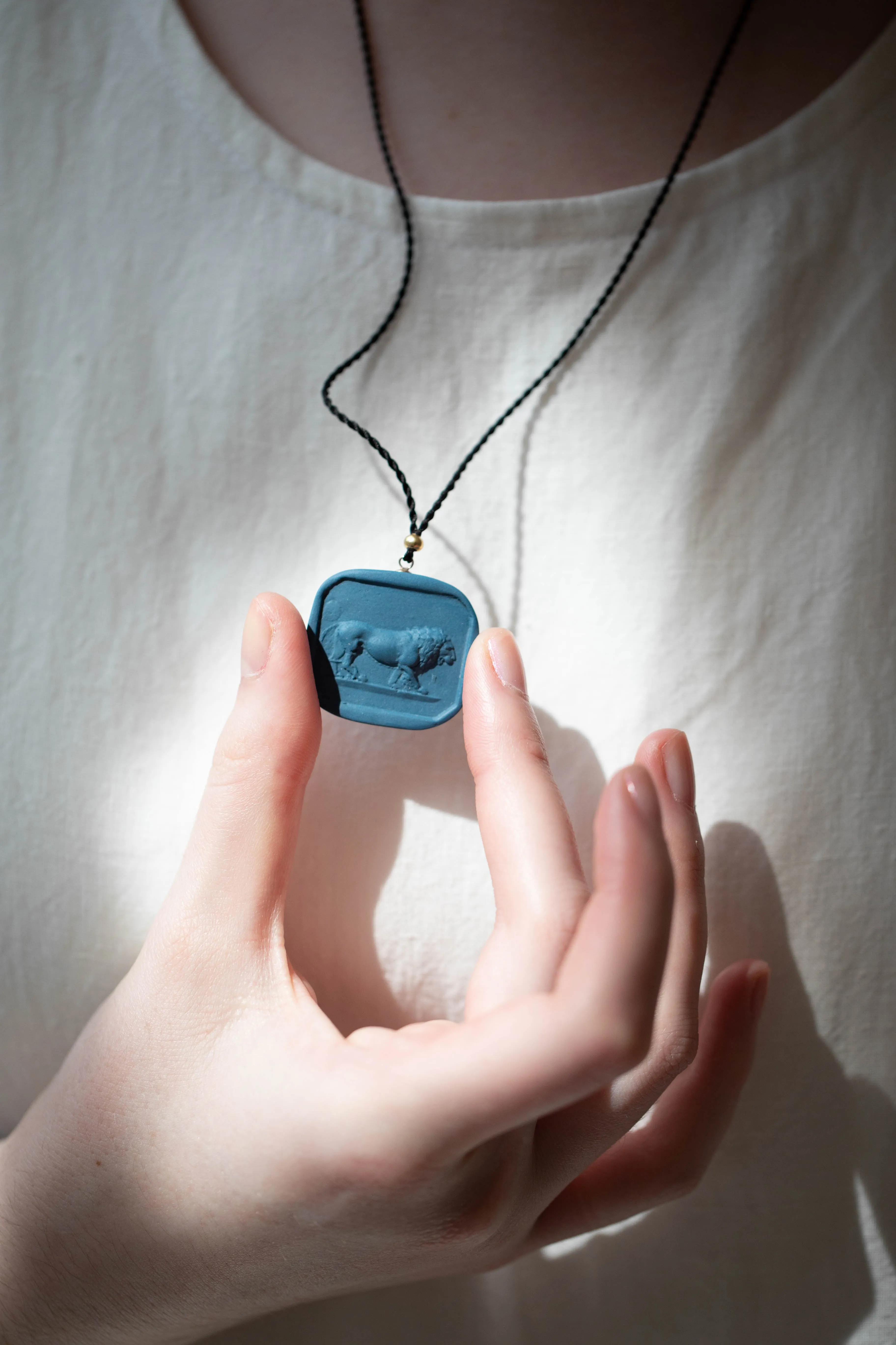 Marcie McGoldrick | Porcelain Cameo Pendant- Leo in Indigo