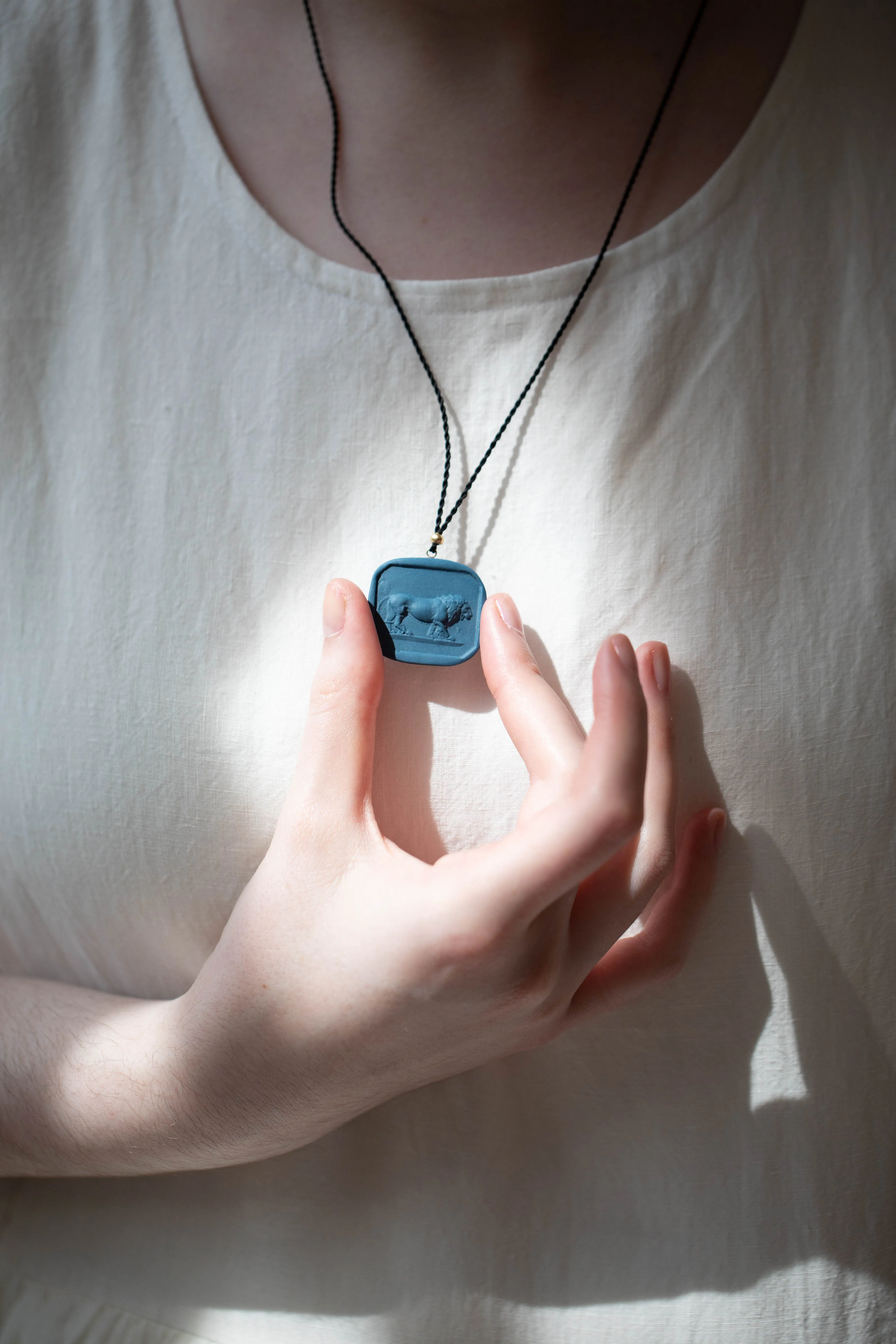 Marcie McGoldrick | Porcelain Cameo Pendant- Leo in Indigo