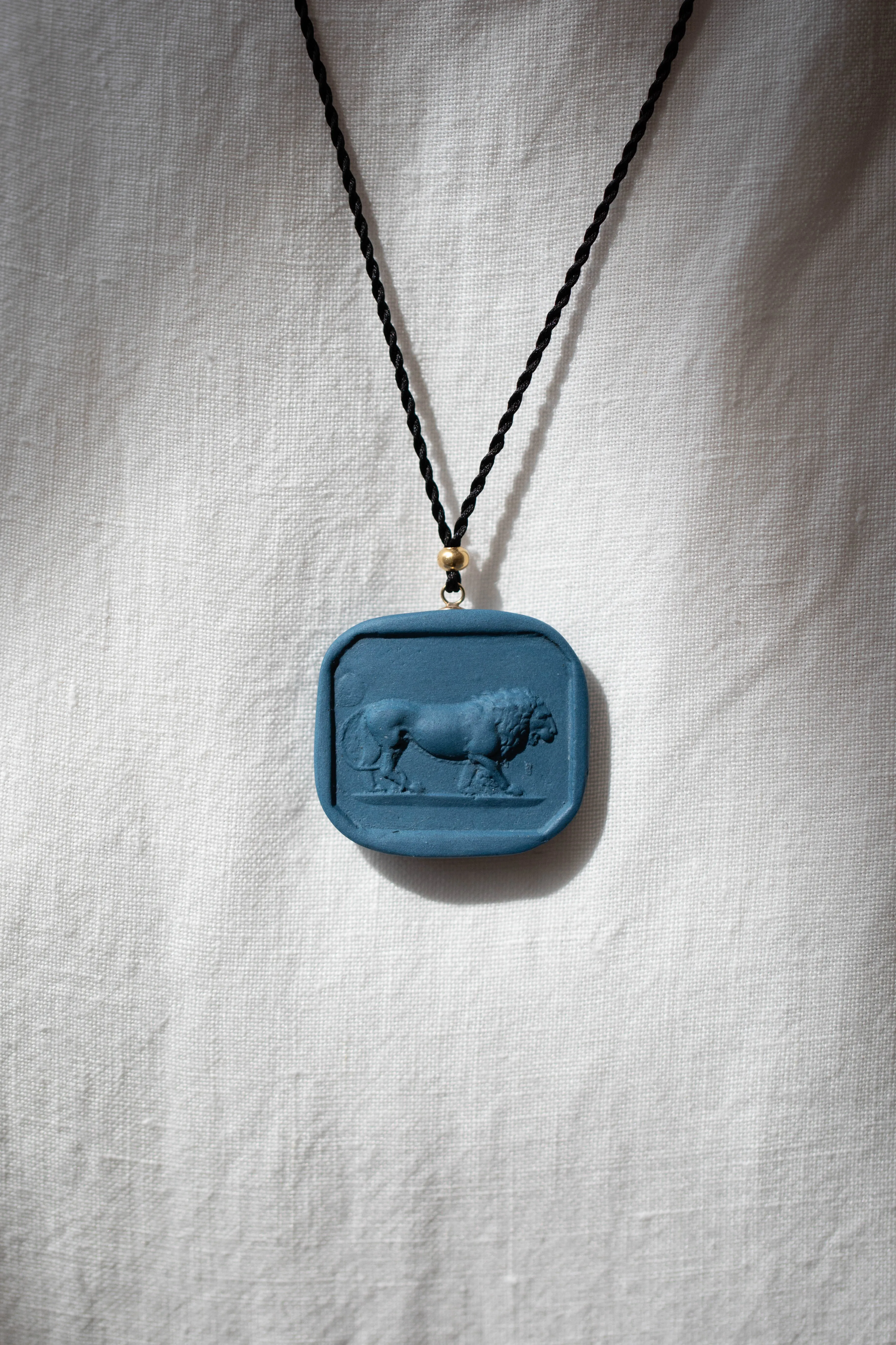 Marcie McGoldrick | Porcelain Cameo Pendant- Leo in Indigo