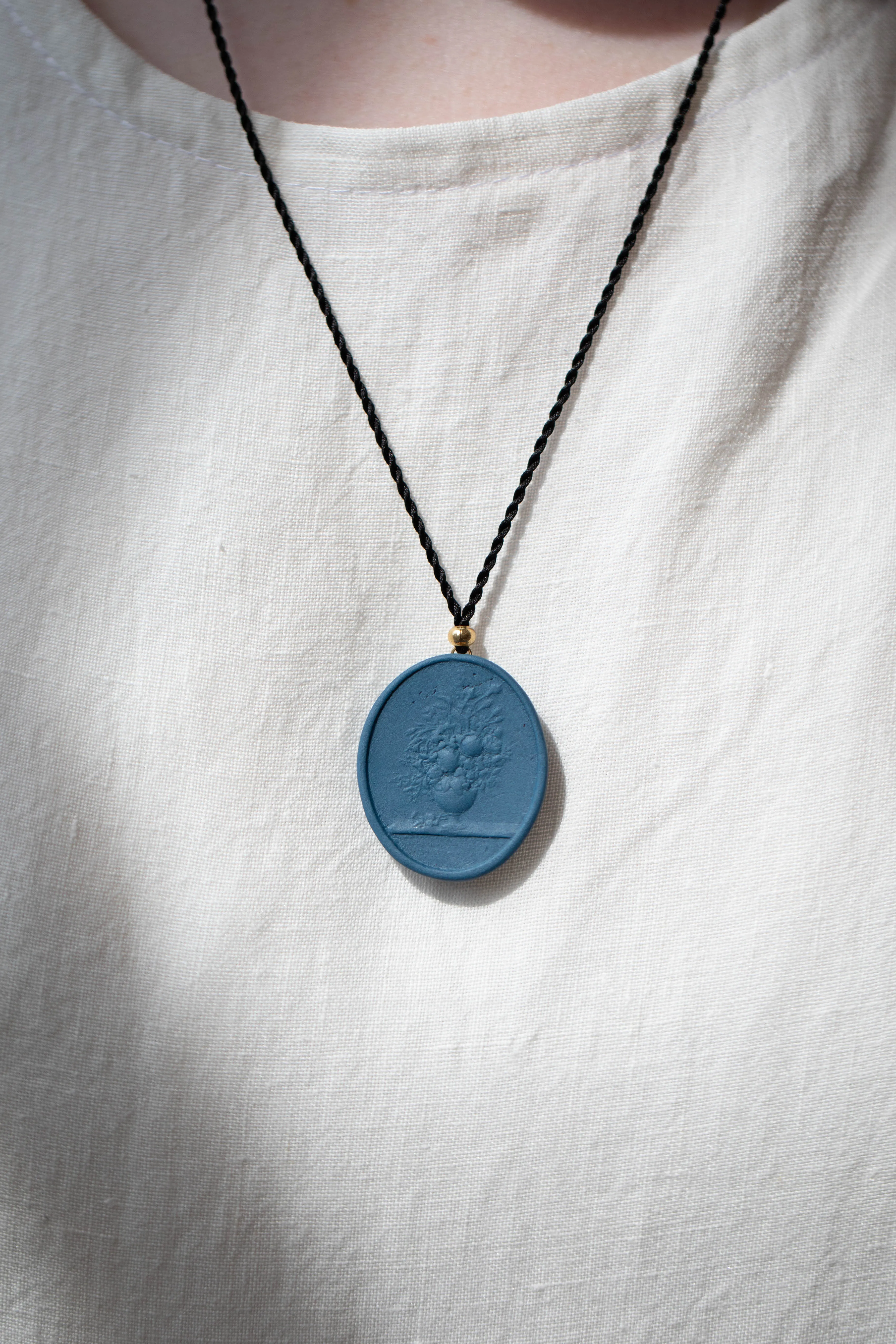 Marcie McGoldrick | Porcelain Cameo Pendant- Vase with Flowers in Indigo