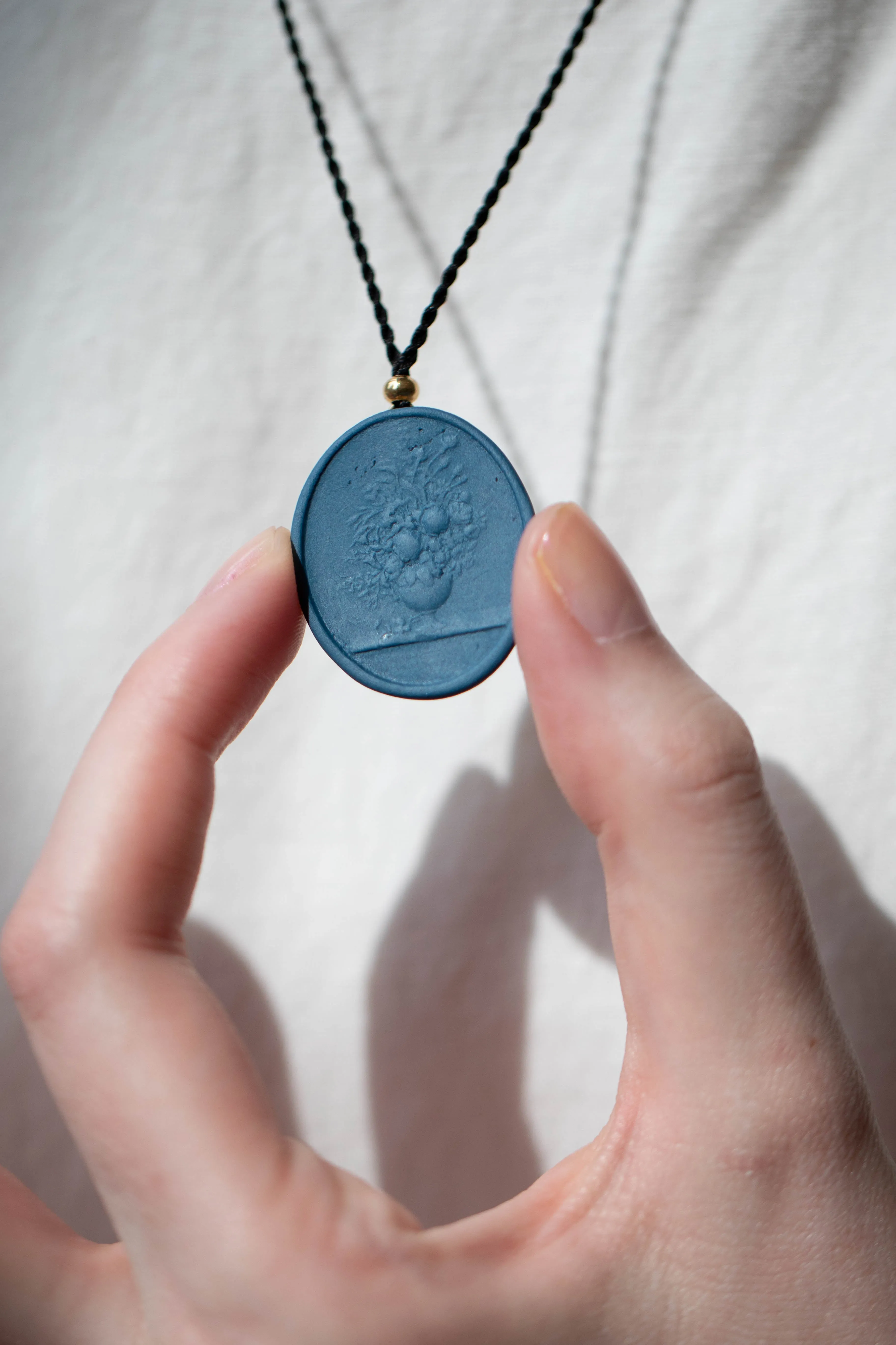 Marcie McGoldrick | Porcelain Cameo Pendant- Vase with Flowers in Indigo